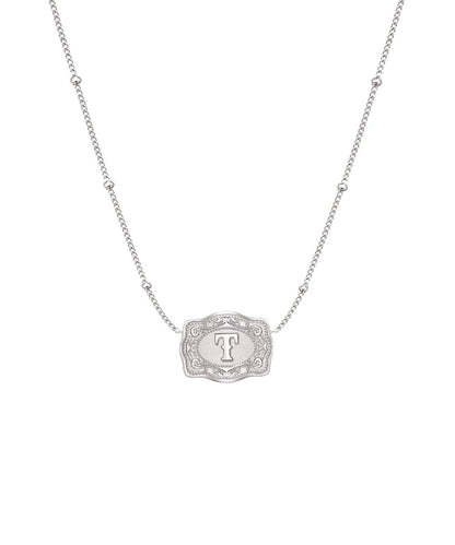 ultra mini silver belt buckle necklace t initial on white background