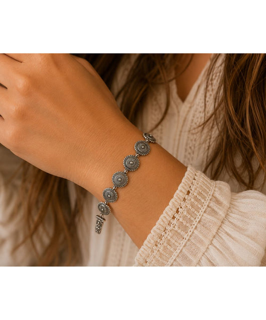 Model view of the women's silver concho bracelet with a magnetic closure
