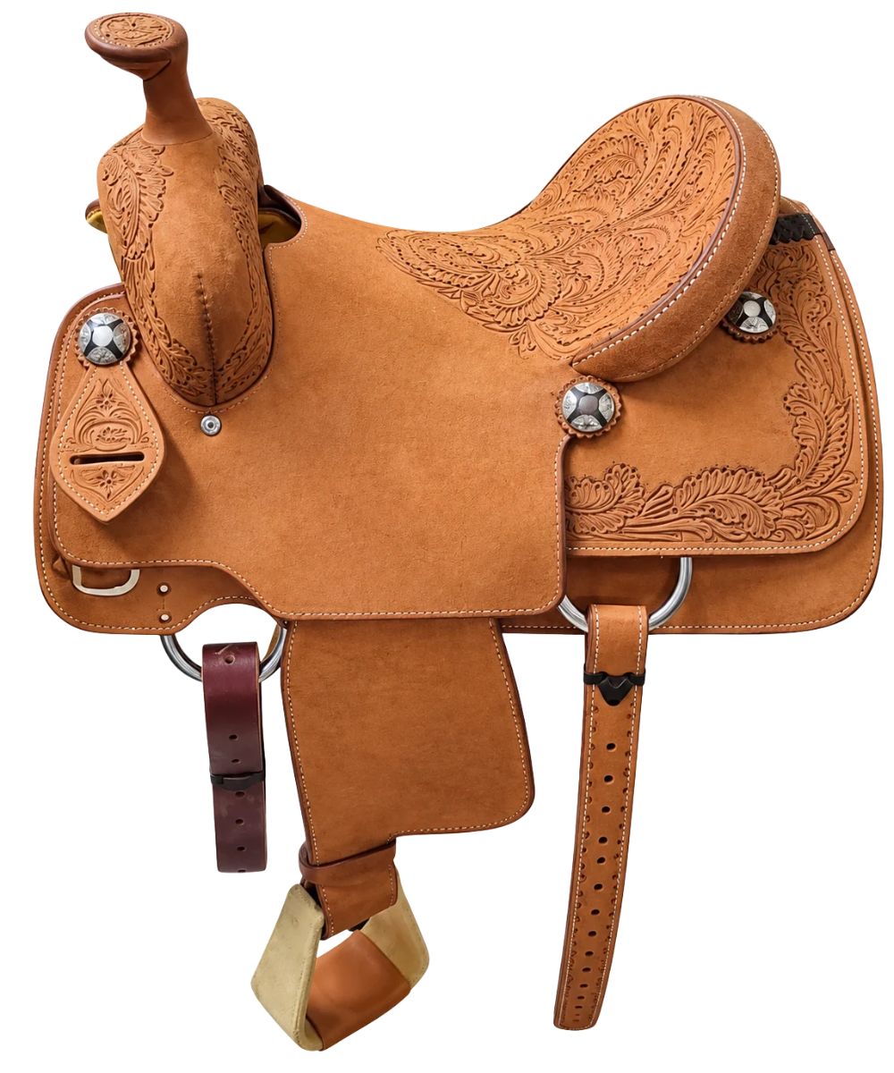 A brown leather Cactus Saddlery western saddle with intricate hand-tooled floral patterns, silver conchos, 14" seat, and leather straps