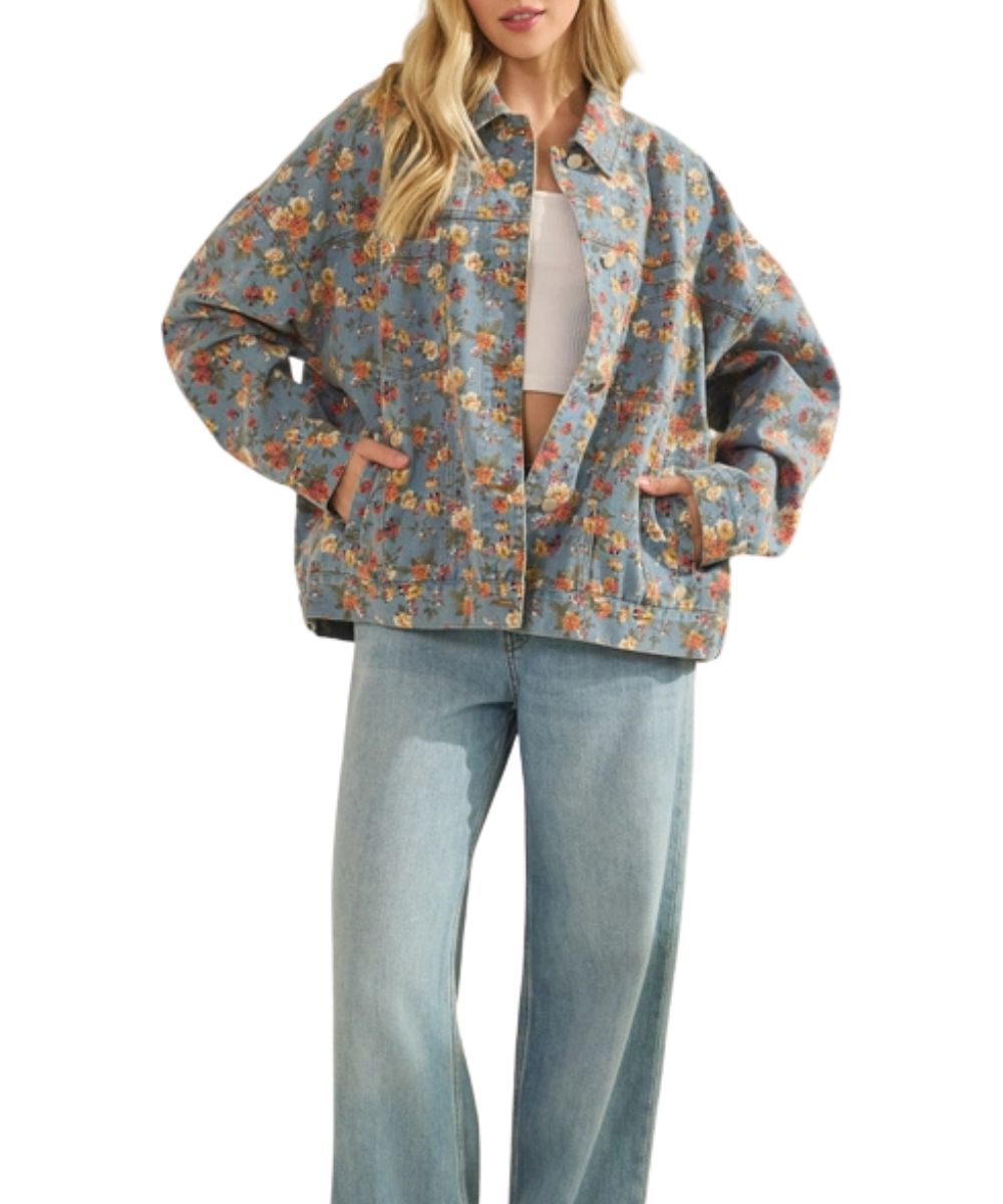 Women's relaxed fit, light wash denim trucker jacket featuring chest and hand pockets, button closure, and dropped shoulders.