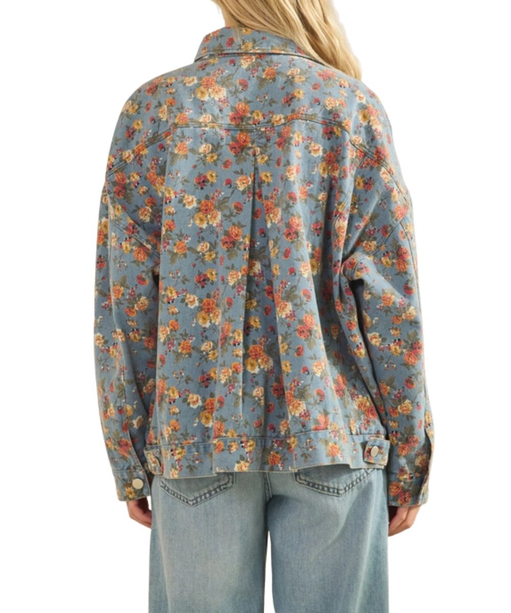 Blue denim jacket featuring a boho floral rose print and an inverted pleat on the back.
