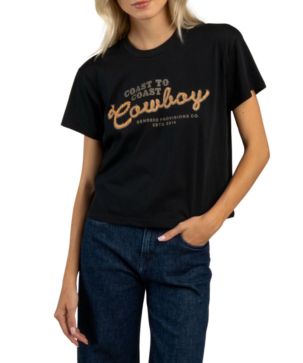 Front view of the women's boxy graphic tee with a front screen print that reads: "Coast to Coast Cowboy"