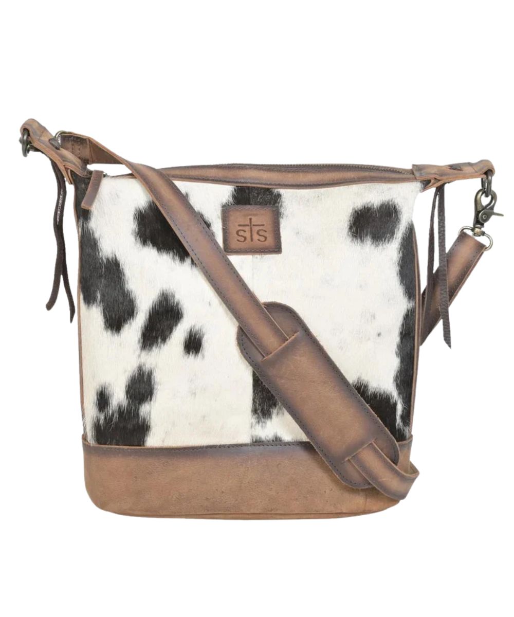 Front view of the women's brown STS Cowhide Mail Crossbody Bag featuring the hair-on-hide front, removable/adjustable crossbody strap, and the zip-top closure