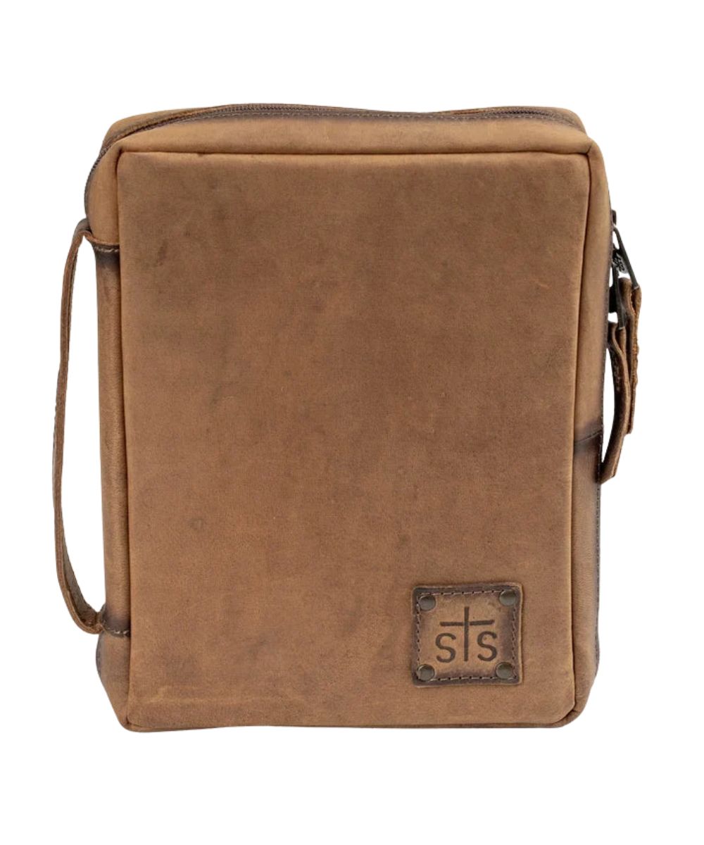 Front view of the brown leather STS Foreman Bible Cover featuring the STS logo patch, zip-around closure, and a loop at the spine for easy comfort carry