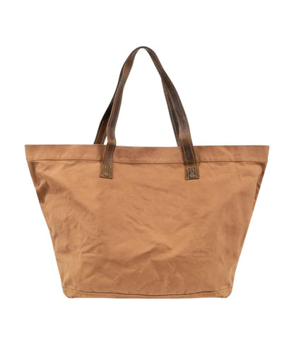 Back view of the large tan tote featuring the plain tan canvas back