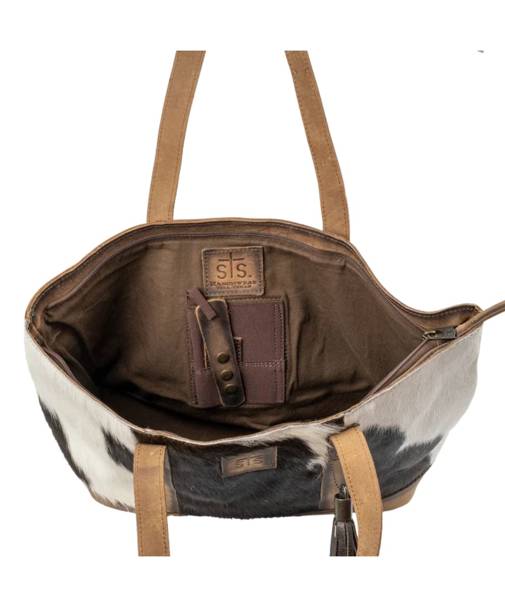 Interior view of the women's brown cowhide tote featuring the interior concealed carry pocket