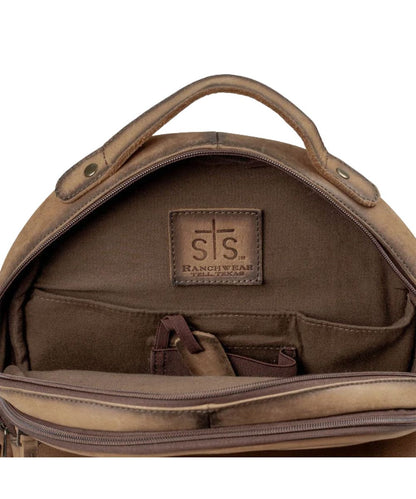 Interior view of the concealed carry pocket inside the brown leather backpack