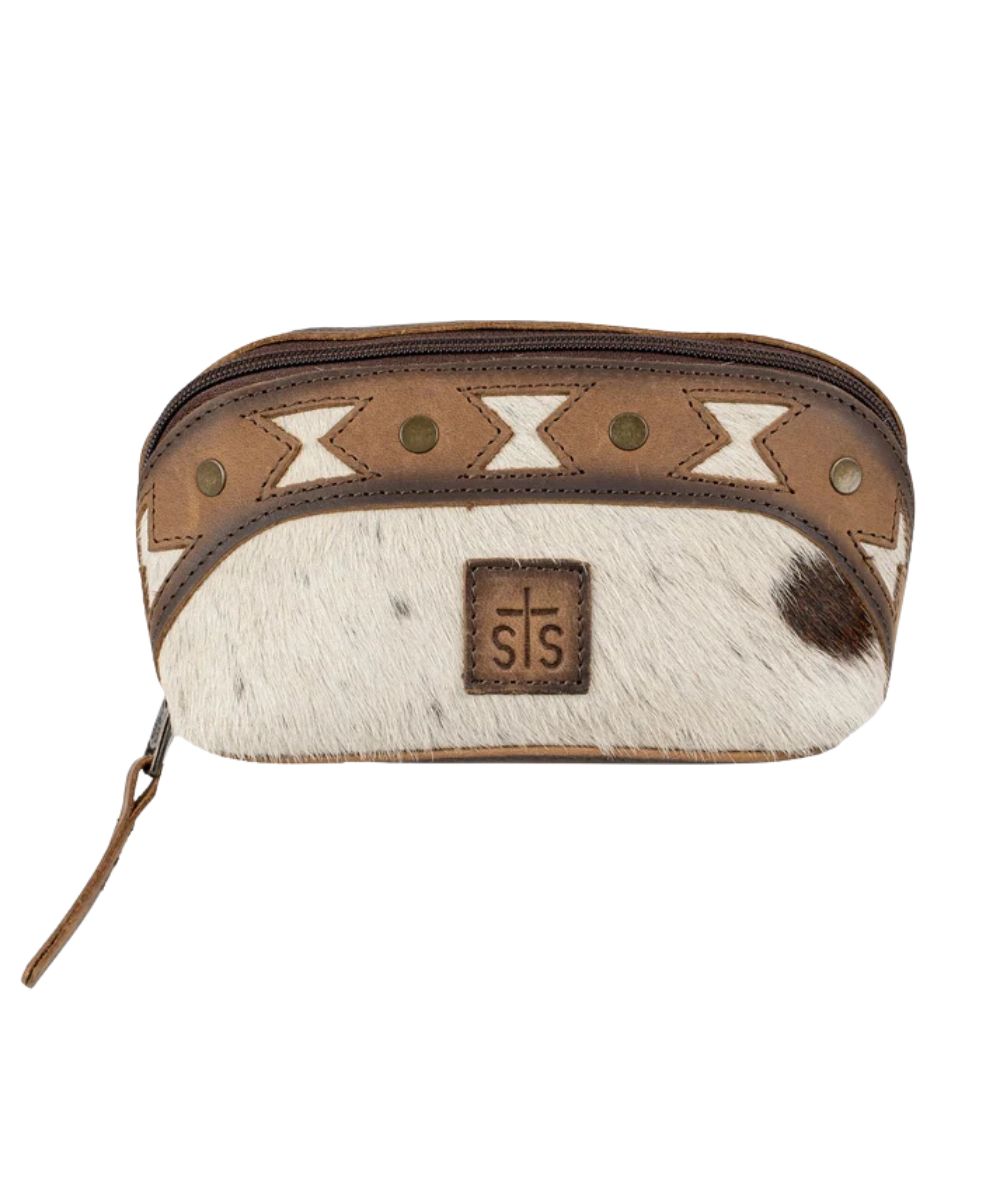 Front view of the women's brown STS Roswell Cowhide Belle Makeup Bag featuring the STS logo patch and zip closure
