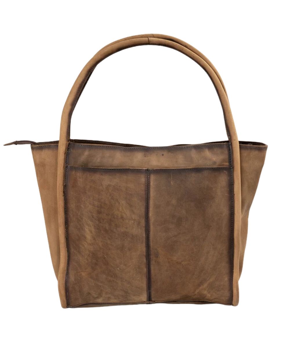 Back view of the women's tote bag featuring the open slip pocket on the back and the zip-top closure