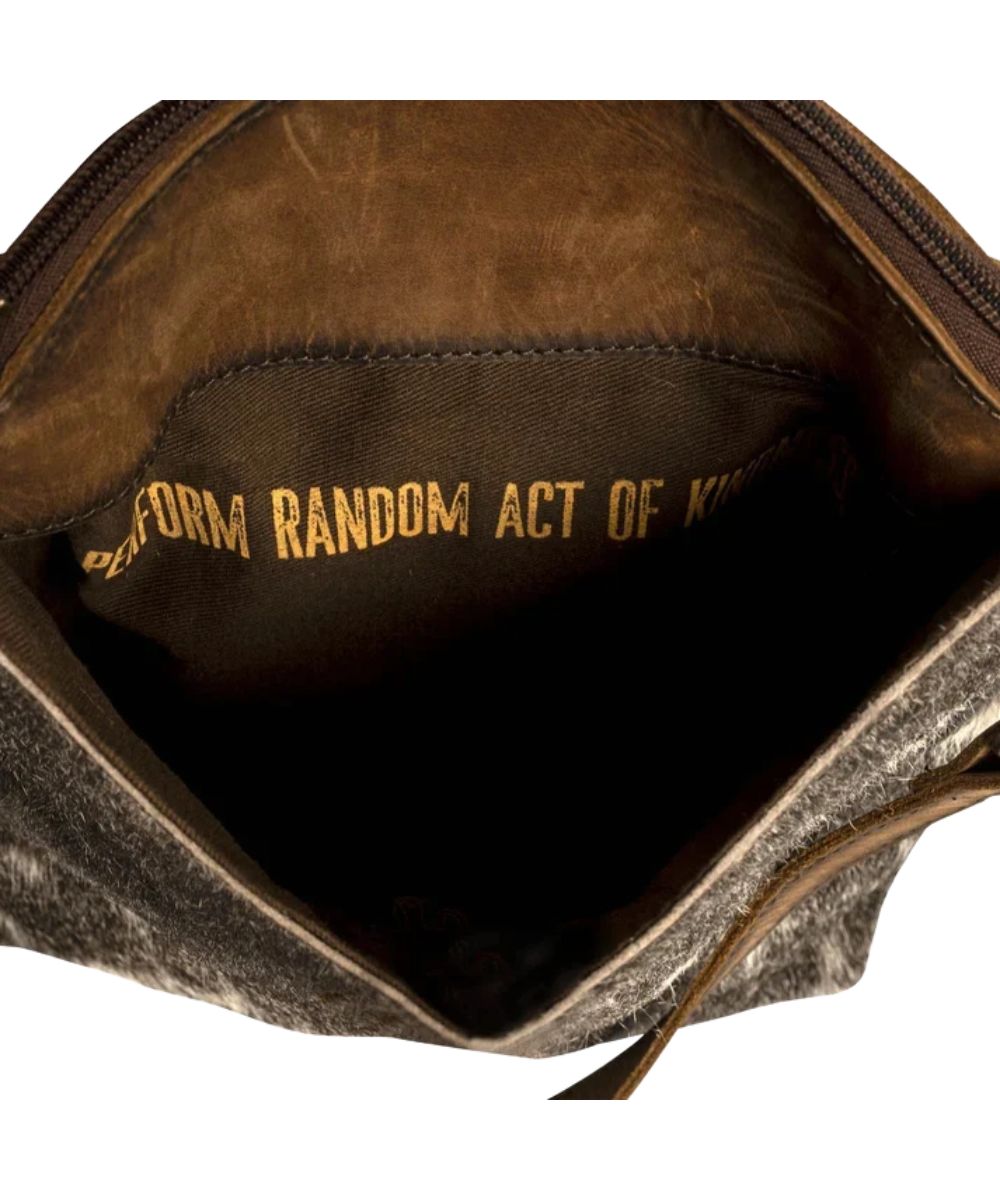 Interior view of the quote inside that reads: "Perform Random Acts Of Kindness."