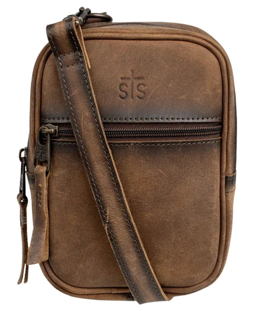 Front view of the dark brown leather Baroness Auzlyn Crossbody featuring the STS stamped leather, front zipper pocket, zip-around closure, and a removable/adjustable crossbody strap