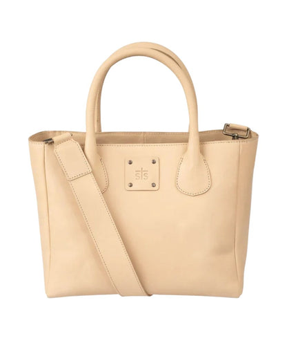 Front view of the women's beige STS Basic Bliss Buckskin Satchel Purse featuring the dual rolled leather carry handles, an STS stamped leather patch, and the removable leather shoulder strap