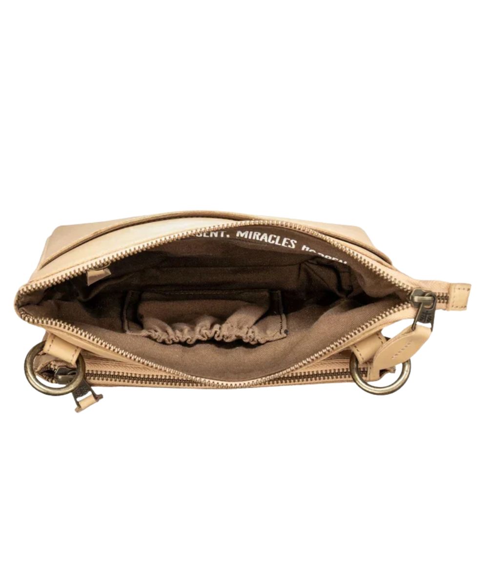 Interior view of the main zip compartment featuring the 1 interior zip pocket and 1 scrunch pocket