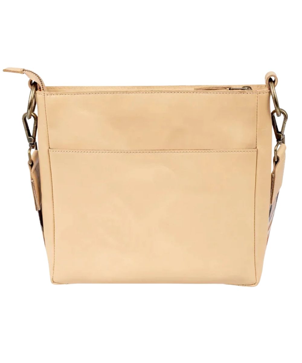 Back view of the women's beige leather crossbody featuring the back exterior slip pocket