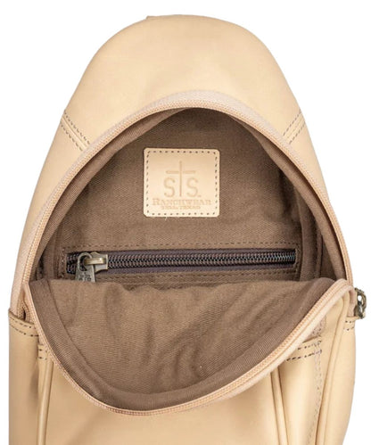Interior view of the women's beige sling bag featuring the interior zip pocket