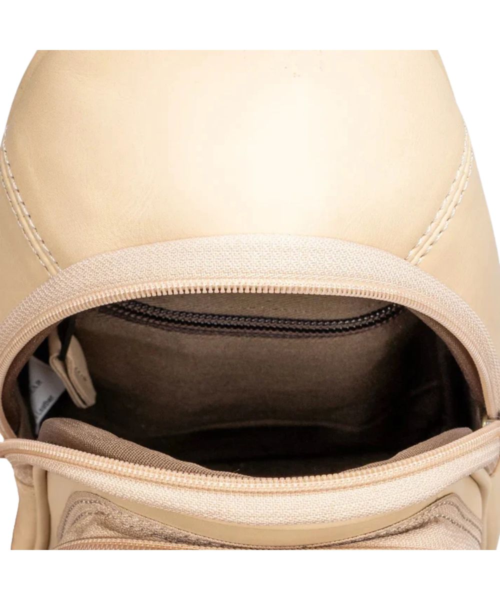 Interior view of the women's beige sling bag featuring the interior zip and slip pockets