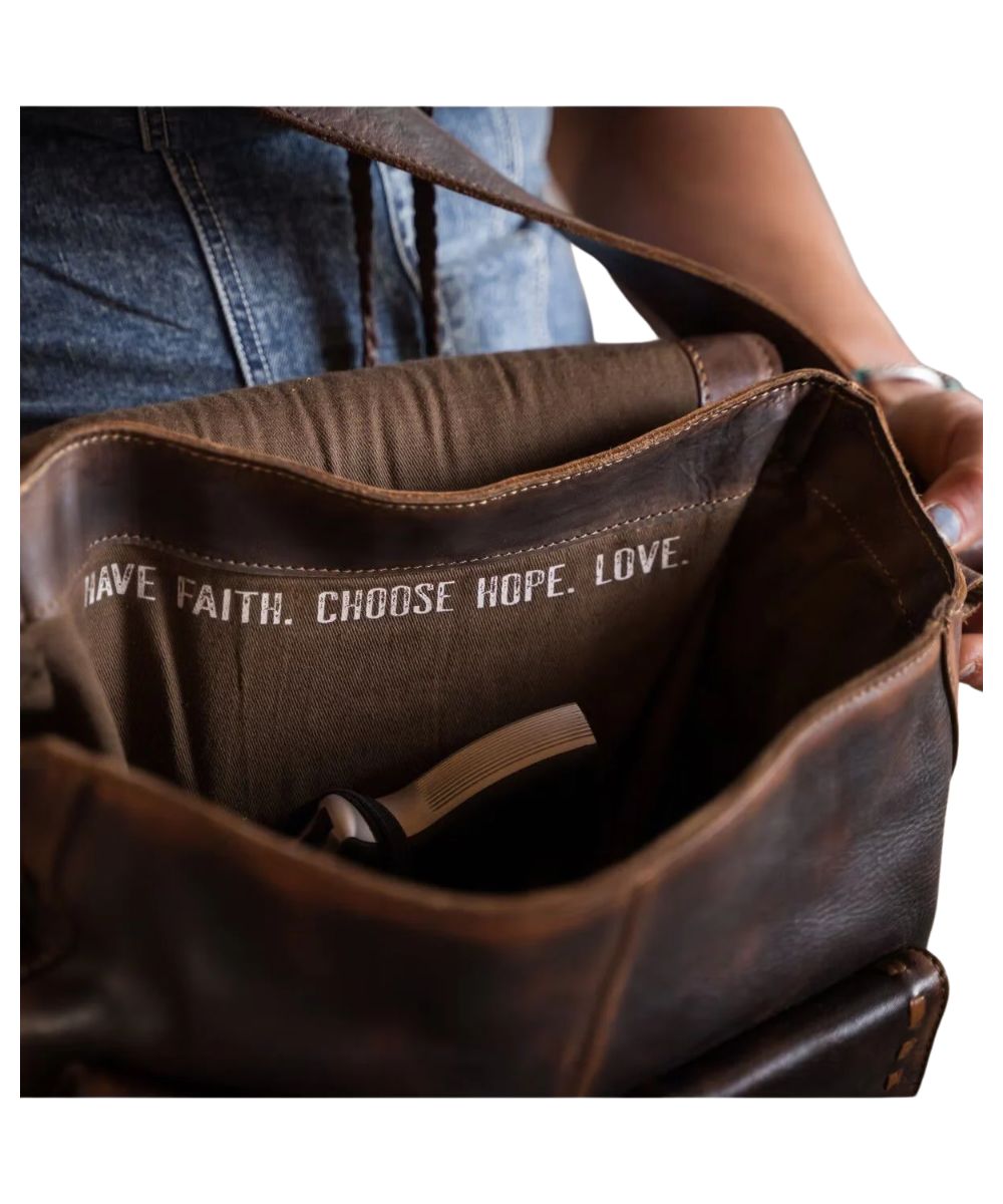 Interior view of the concealed carry pocket and a quote that reads: "Have Faith. Choose Hope. Love."