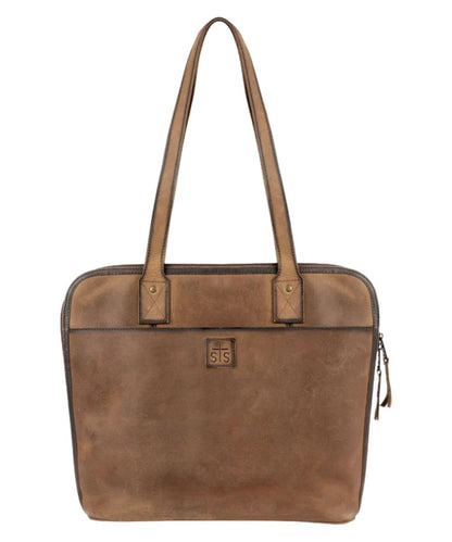 Front view of the brown leather STS Baroness Laptop Portfolio featuring the STS branded logo patch, front slip pocket, zip closure, and the dual shoulder straps