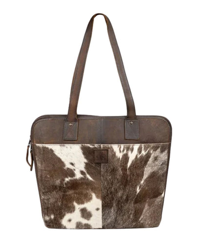 Front view of the women's dark brown STS Cowhide Laptop Shopper Bag featuring the dual leather carry handles, STS logo patch, and hair-on-hide front