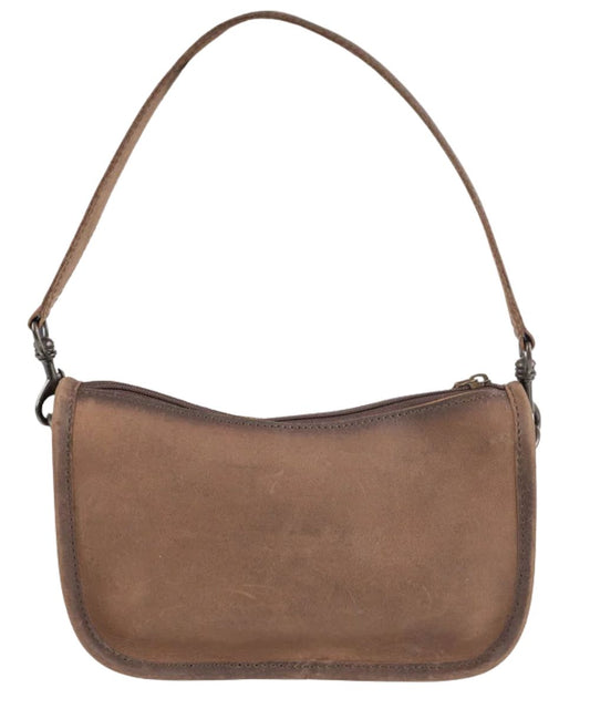 Back view of the women's cowhide purse featuring the solid brown leather back and the leather shoulder strap