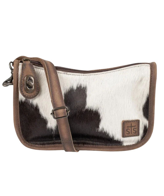 Front view of the women's brown STS Cowhide Emmy Purse featuring the removable/adjustable crossbody strap, zip-top closure with pull lock, hair-on-hide front, and an STS leather logo patch
