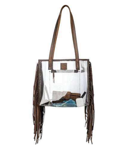 Front view of the women's clear STS Stadium Rules Fringe Tote Bag featuring the clear vinyl construction, leather fringed sides, STS logo patch, and brown leather shoulder straps