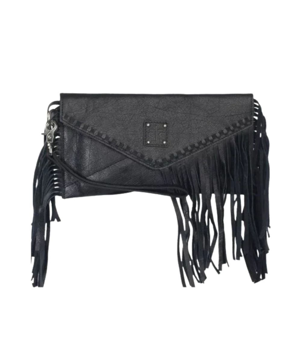 Front view of the women's black STS Indie Clutch featuring the removable wristlet strap, leather fringe, whipstitch details, STS logo patch, and magnetic fold closure