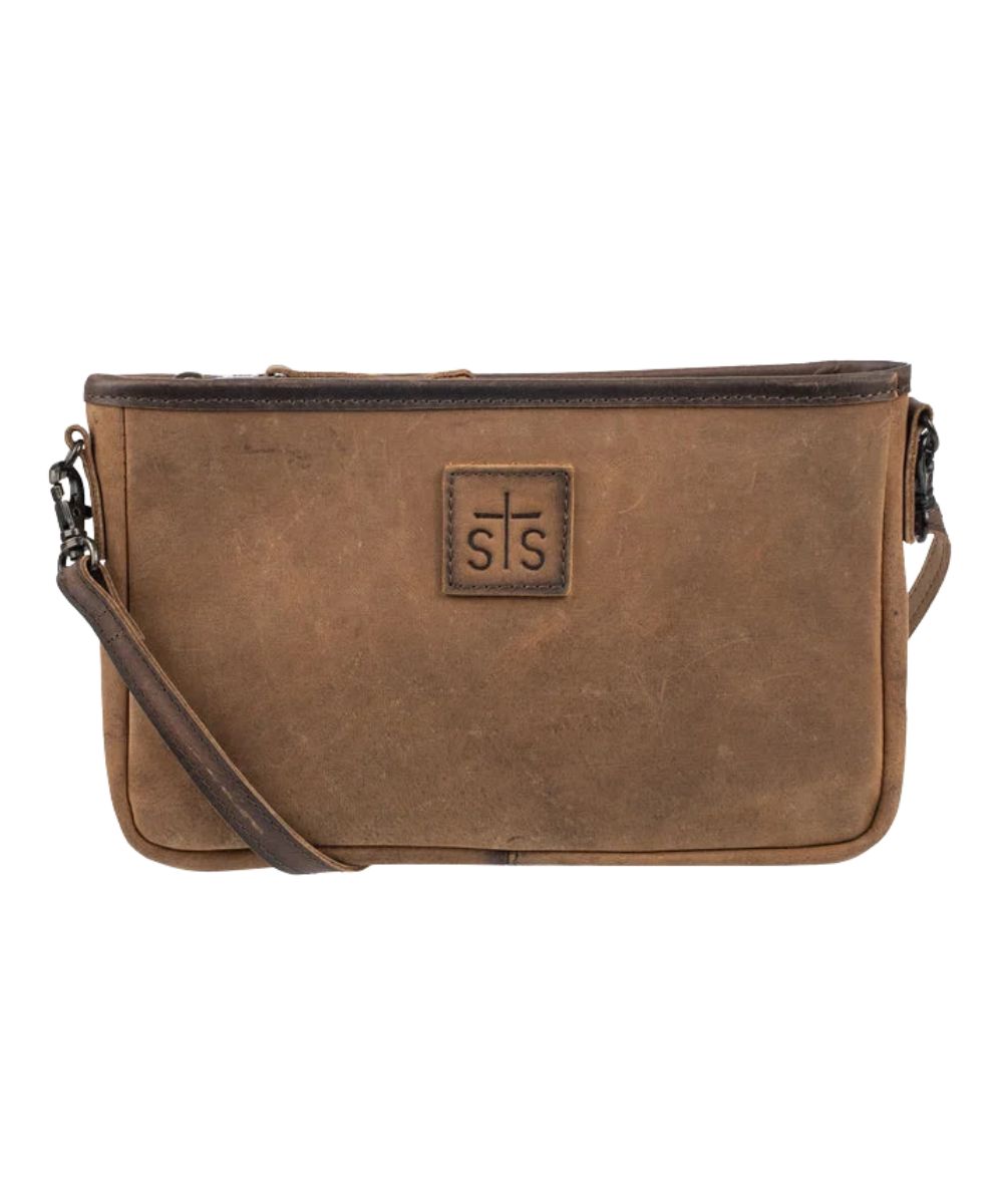 Front view of the women's brown STS Baroness Claire Crossbody featuring the genuine leather construction, STS branded leather patch, and an adjustable/removable leather crossbody strap