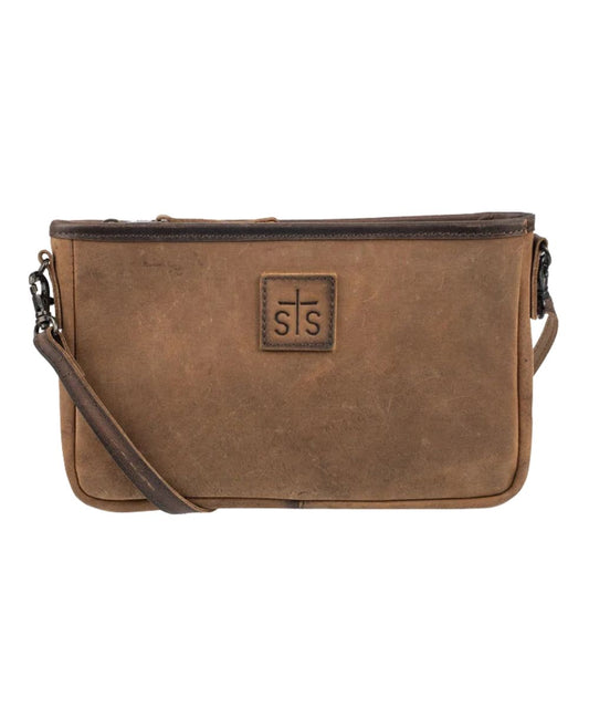 Front view of the women's brown STS Baroness Claire Crossbody featuring the genuine leather construction, STS branded leather patch, and an adjustable/removable leather crossbody strap