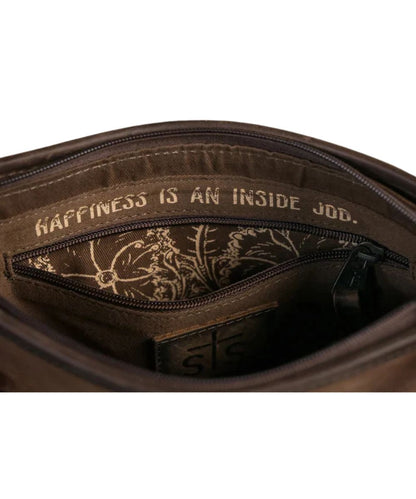 Close-up interior view of the zip closure compartment featuring the interior zip pocket with an inside quote above it that reads: "Happiness Is An Inside Job."