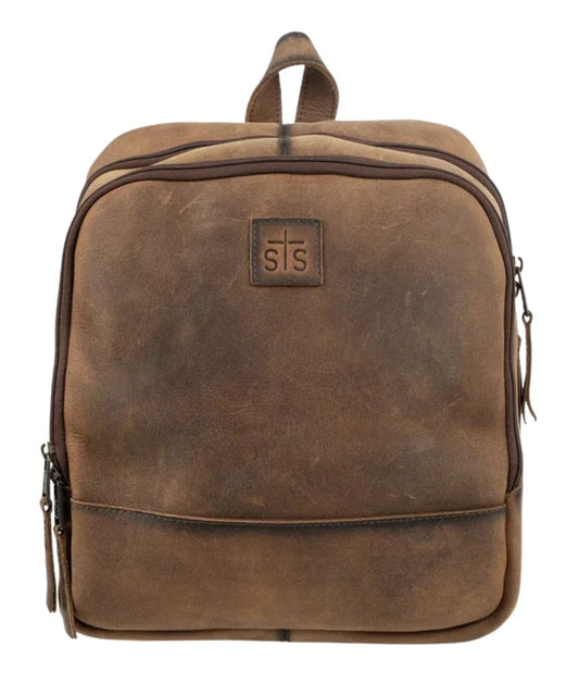 Front view of the brown leather STS Baroness Mini Backpack featuring the STS branded leather patch, top leather carry handle, and the zip-around closure