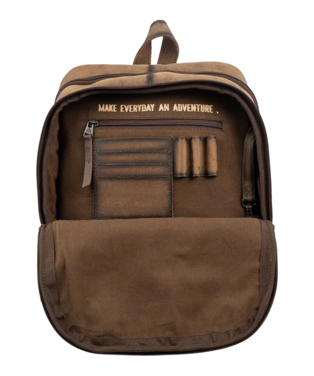 Interior view of the front zip pocket featuring the interior zip pocket, pen slots, card slots, keychain clasp, and a quote that reads: "Make Everyday An Adventure."
