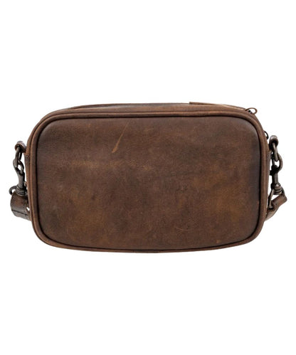 Back view of the women's brown leather crossbody bag featuring the solid brown back