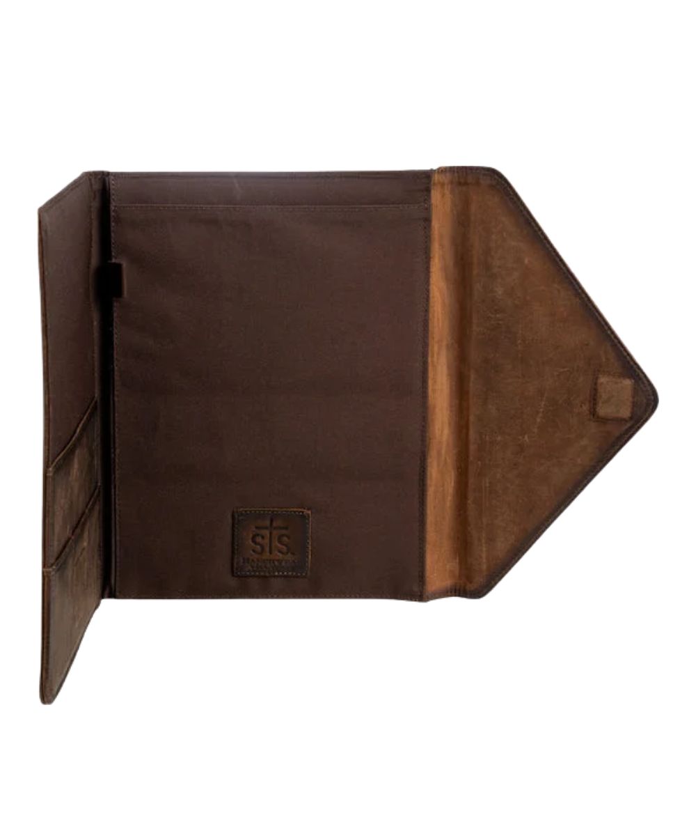 Interior view of the notepad slip pocket, pen slot, and slip pockets featuring the magnetic flap closure