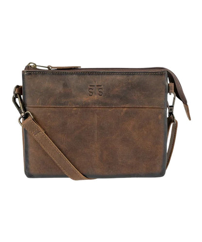 Front view of the women's brown Baroness Rio Crossbody featuring the genuine leather construction, STS branded leather, and a removable/adjustable leather crossbody strap