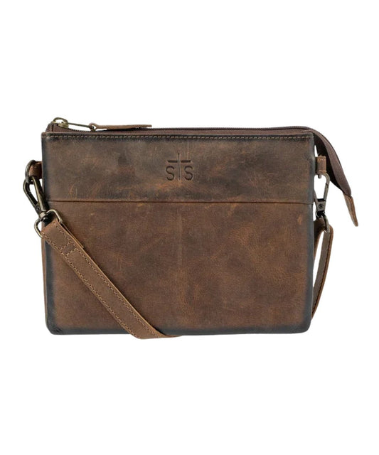 Front view of the women's brown Baroness Rio Crossbody featuring the genuine leather construction, STS branded leather, and a removable/adjustable leather crossbody strap