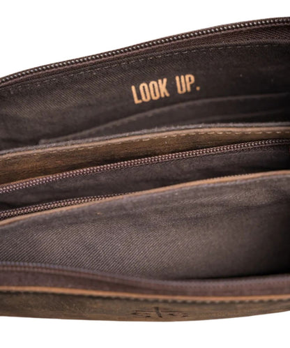 Close-up view of the interior featuring the 3 interior zip pockets and a quote that reads: "Look Up."