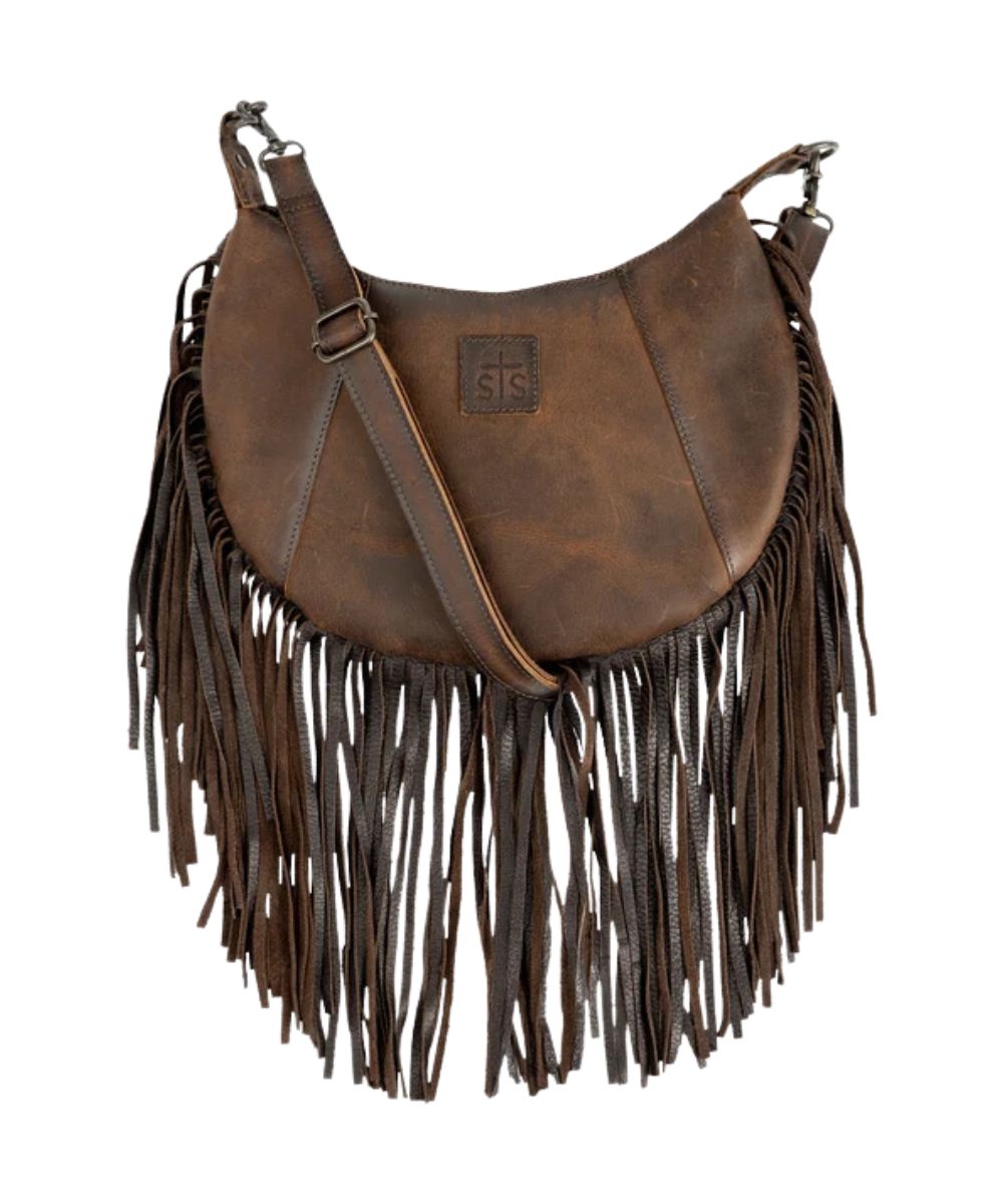 Front view of the women's brown STS Baroness Nelly Crossbody featuring the STS branded logo patch, leather fringe, and a removable/adjustable leather crossbody strap