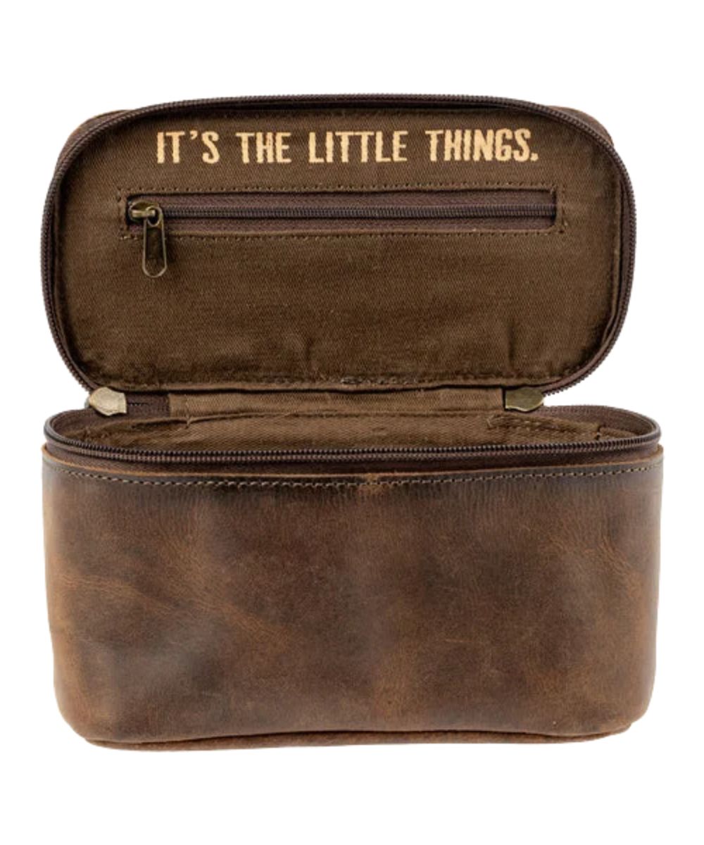 Interior view of the brown leather train case featuring the quote inside that reads: "It's The Little Things."