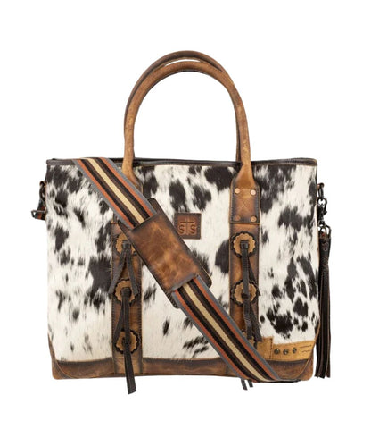Front view of the women's brown leather cowhide tote featuring the removable/adjustable nylon strap with a leather shoulder pad