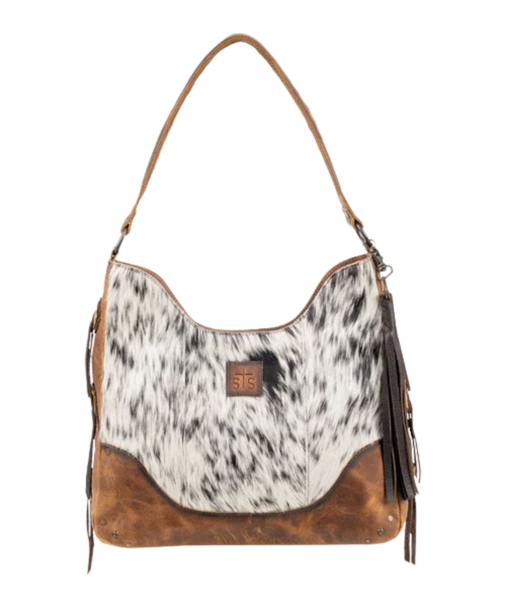 Front view of the women's STS Guadalupe Cowhide Hobo Bag featuring the tassel keychain holder and the non-removable brown leather shoulder strap