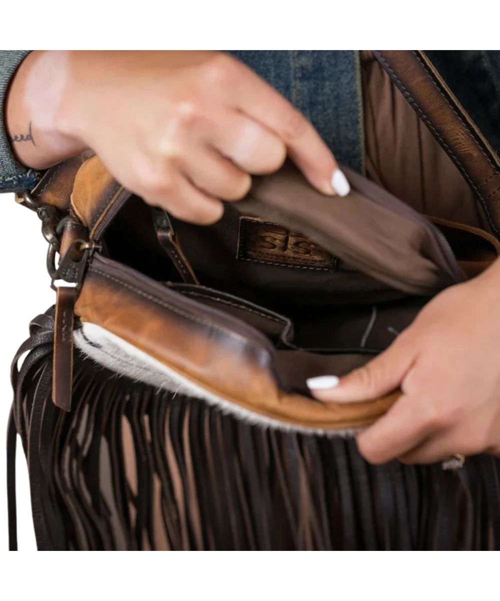 Interior view of the women's crossbody featuring the zipper pocket and 2 slip pockets