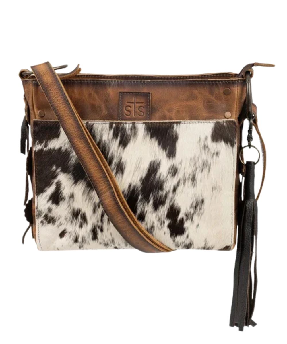 Front view of the women's STS Guadalupe Cowhide Olivia Crossbody Purse featuring the fringe tassel and the magnetic front compartment