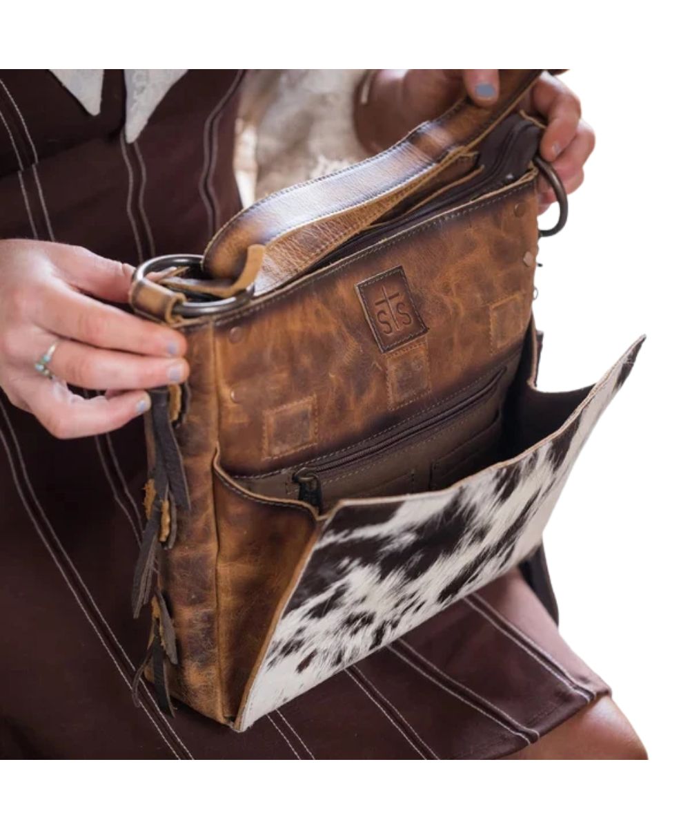 View of the magnetic closure front pocket featuring an ID slot, card slots, and a zipper pocket