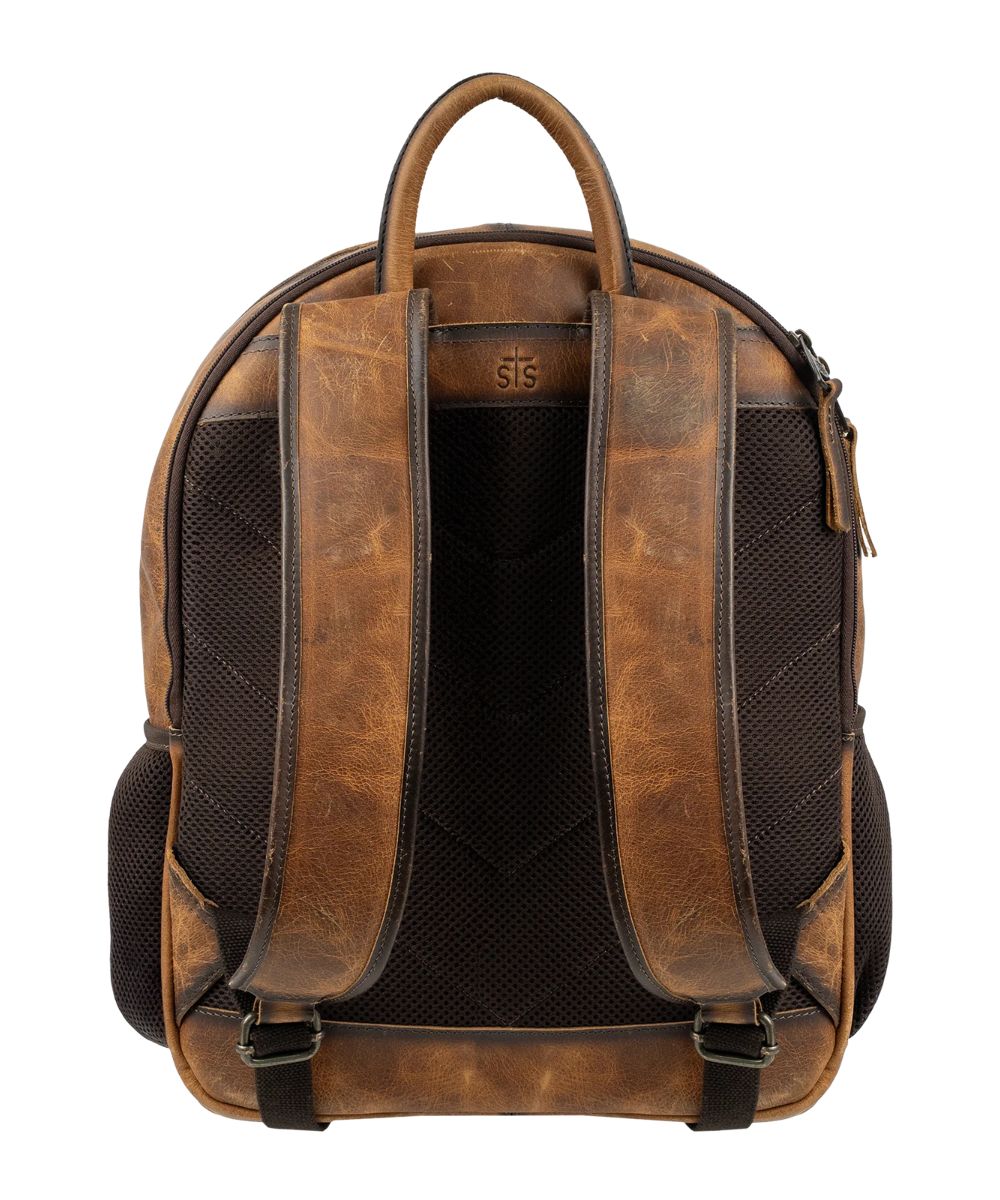 Back view of the brown leather cowhide backpack featuring the adjustable padded leather backpack straps and side mesh pockets