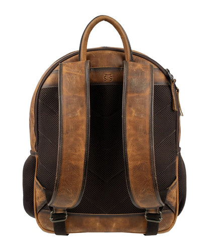 Back view of the brown leather cowhide backpack featuring the adjustable padded leather backpack straps and side mesh pockets