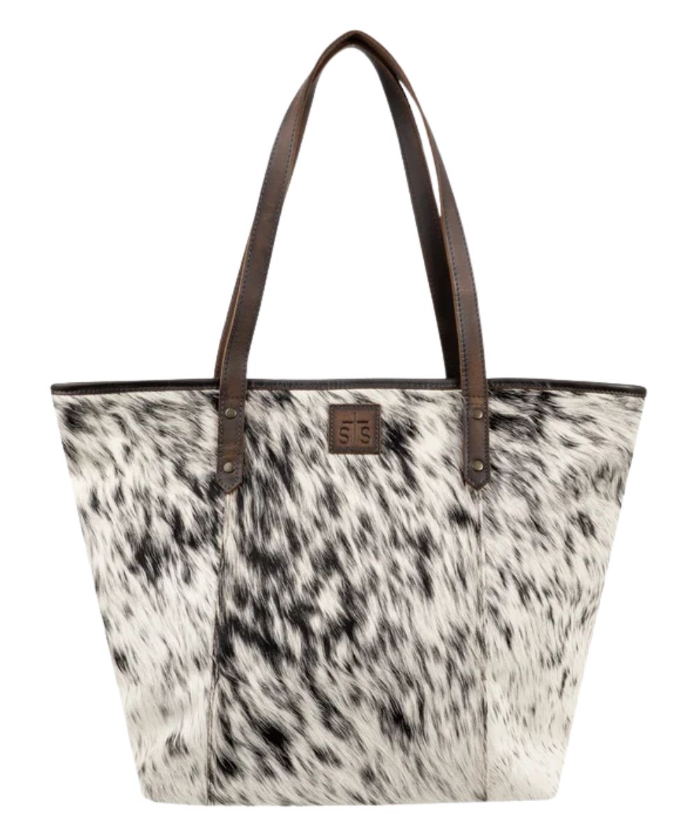 Front view of the women's brown STS Cowhide Laptop Tote featuring the dual leather carry handles, STS branded leather, and the hair-on-hide front