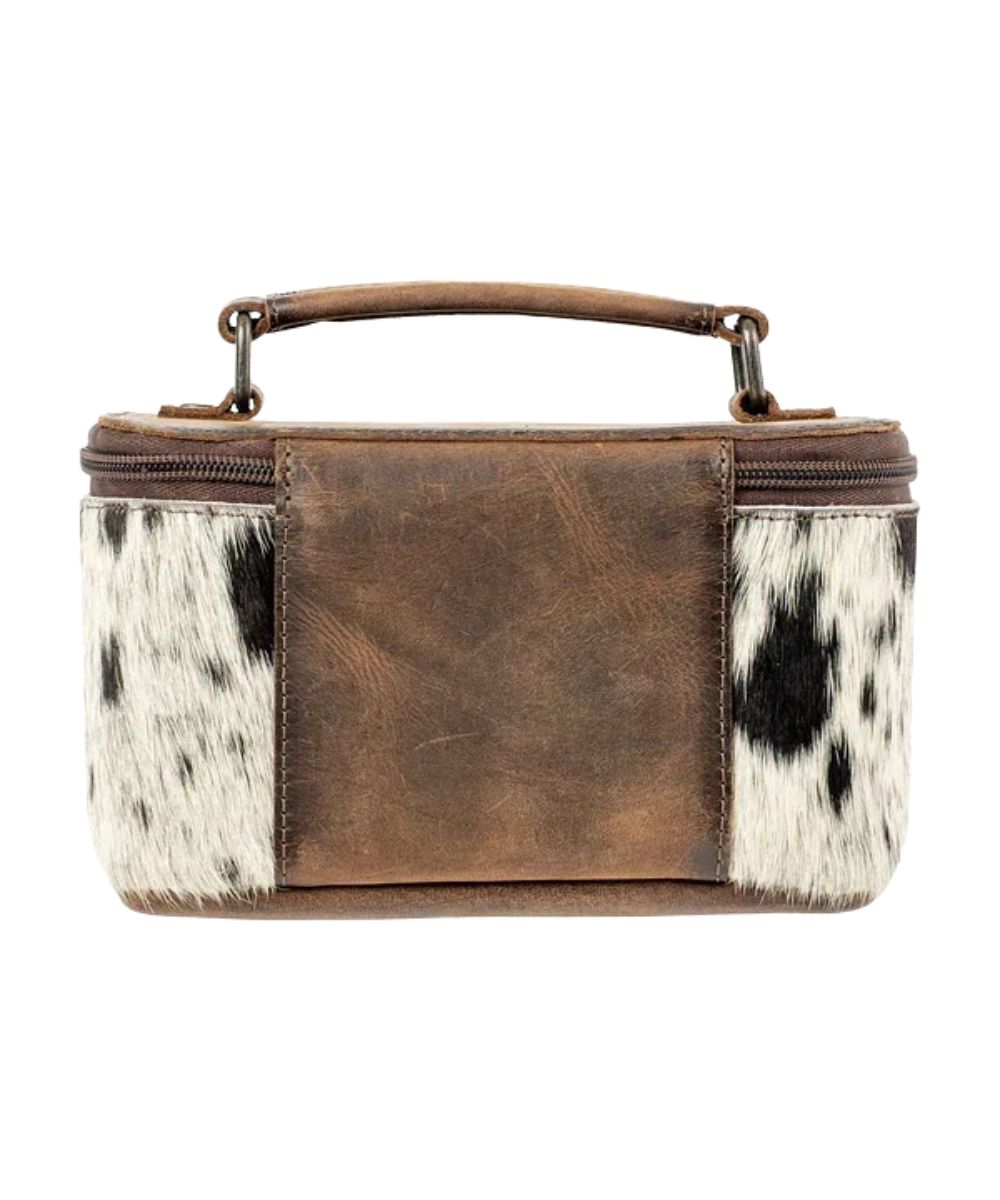 Back view of the women's cowhide full grain leather in brown featuring the top carry handle and zip closure