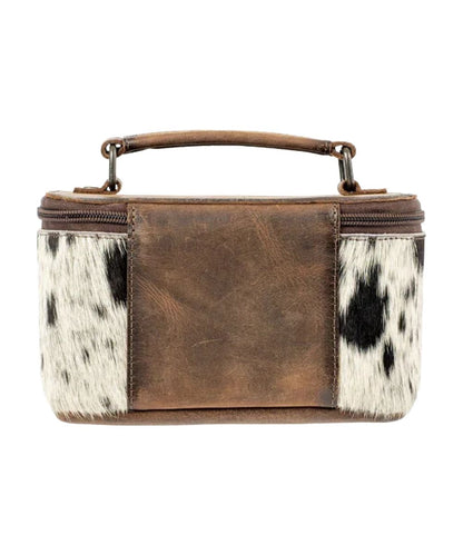 Back view of the women's cowhide full grain leather in brown featuring the top carry handle and zip closure