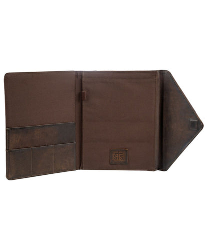 A brown leather and canvas document holder or passport cover shown open against a plain white background, featuring multiple card slots, a central pocket, and a small square logo patch on the inside flap.